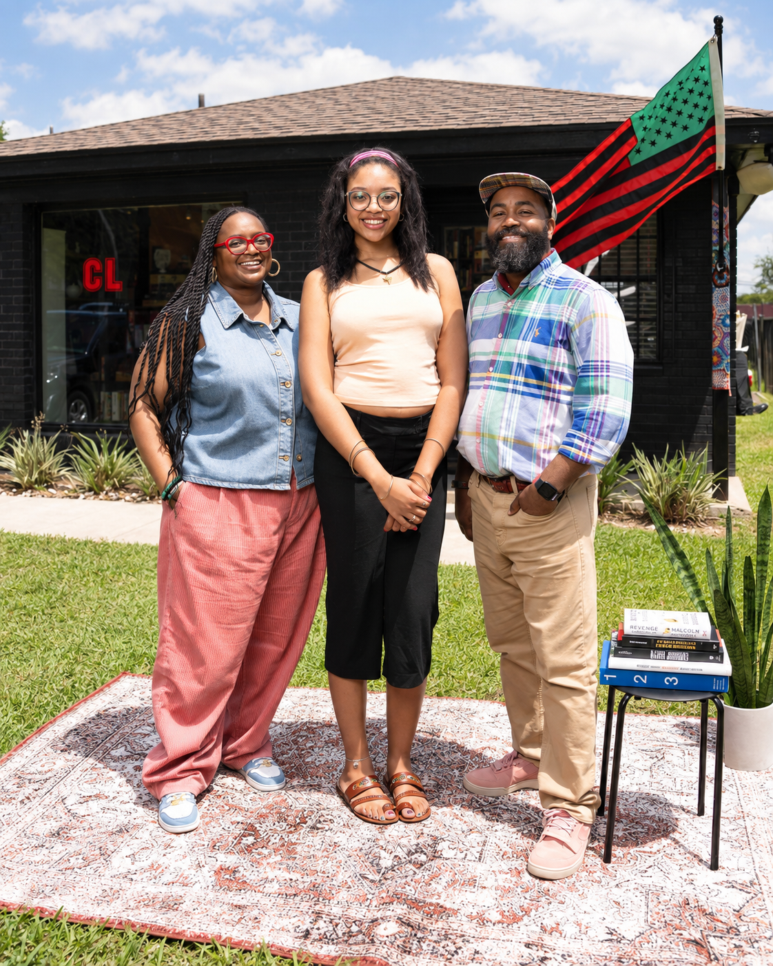 CLASS Bookstore owners David and Dara Landry with a team member outside the shop